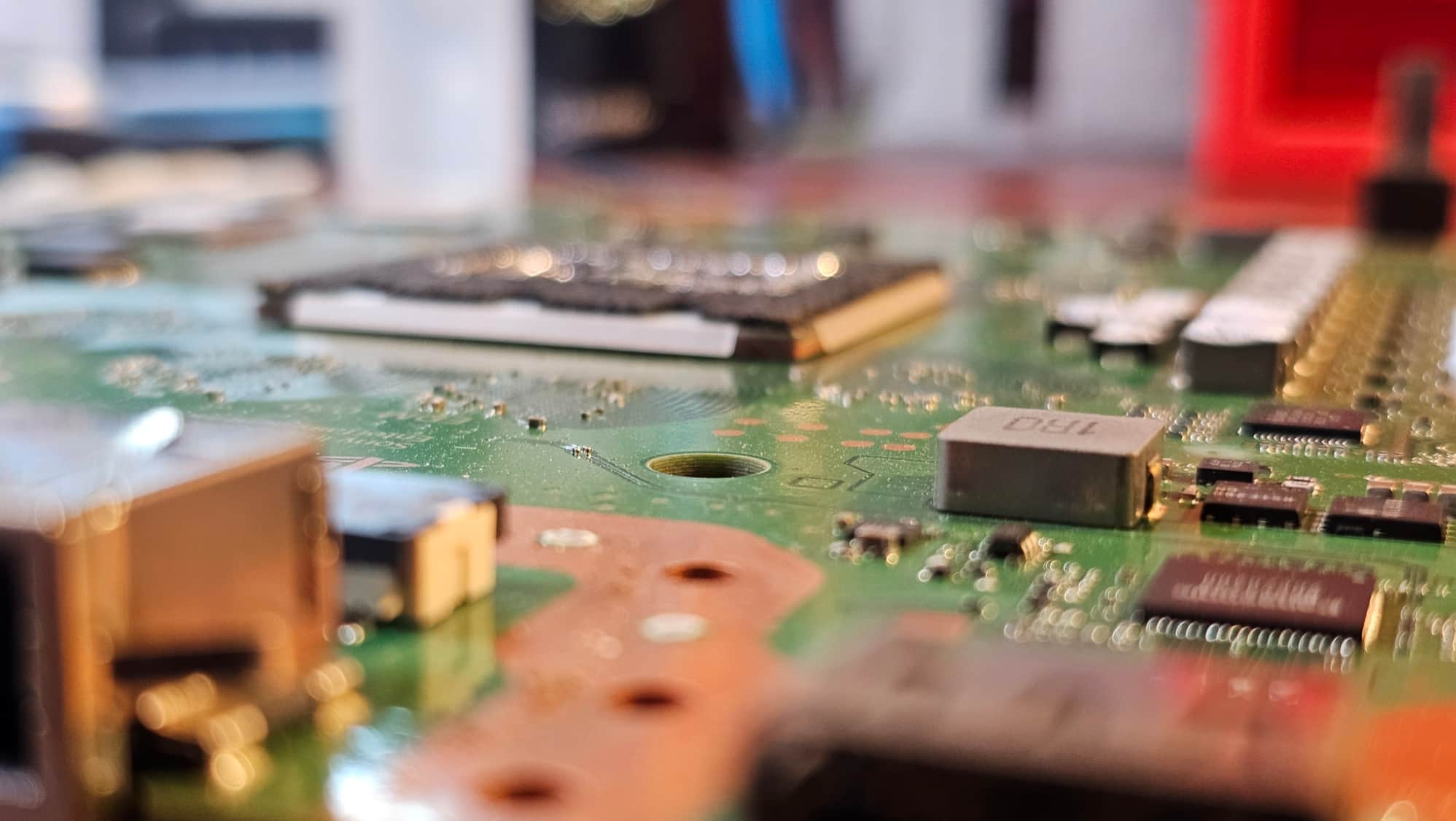 Close view of console motherboard components during repair