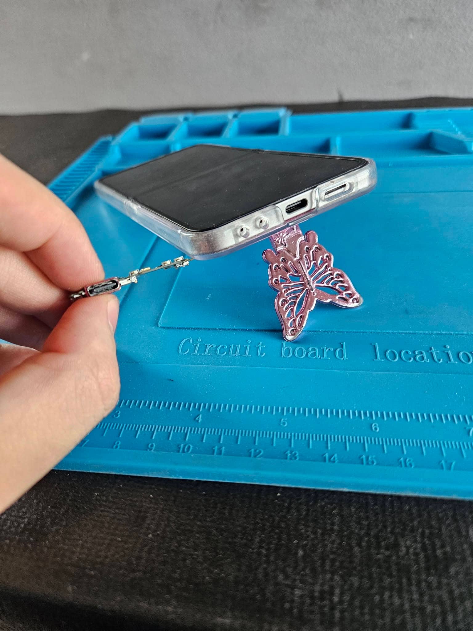 Phone USB-C charging port assembly during repair