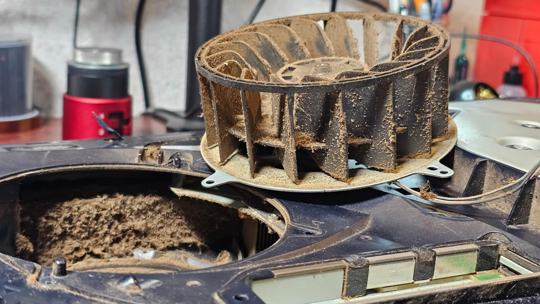 Dust buildup inside a PlayStation 5 during cleaning service